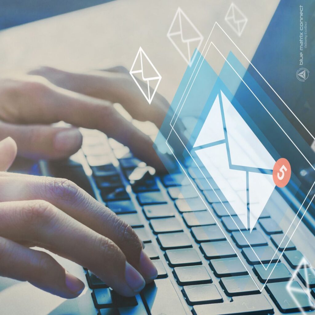 Person typing on a laptop keyboard with email icons overlay, representing email marketing for rebate updates and customer engagement.